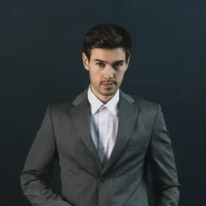 confident young man with his hand pocket against black background (1).png